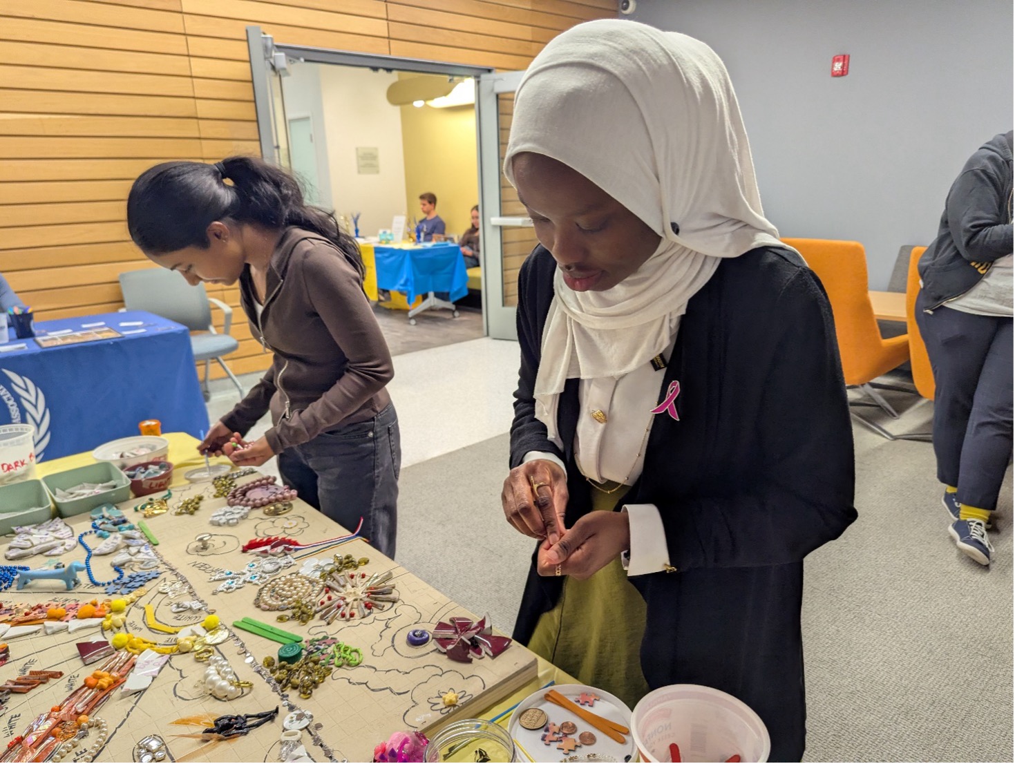 Student helping decorate mosaic at McGonigal ARC